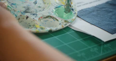 Paint Brush Mixing Paint in Tray Stock Footage 145178904