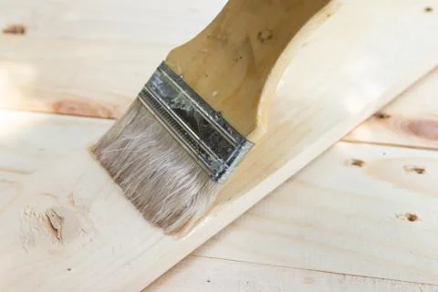 Paint brush with Shellac oil paint on wood Photos