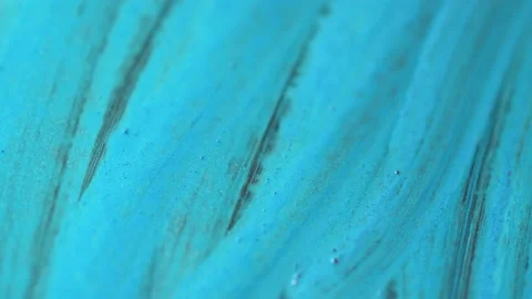 Paint brush on surface. Turquoise acrylic on canvas. Open colored tube on floor Stock Footage 150576367