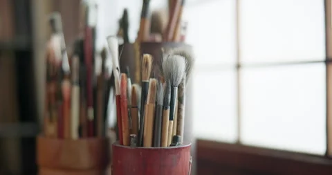 Paint brush, tools and cup closeup or art project product in class or creativity Vídeo Stock 260783178