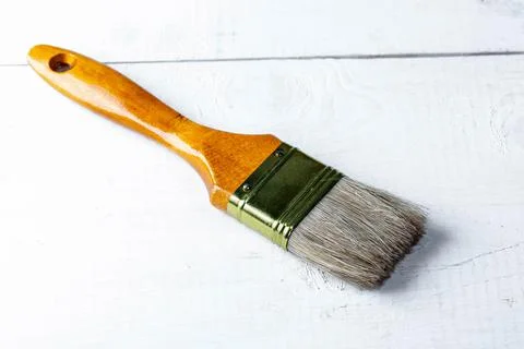 Paint brush on white wooden background Stock Photos