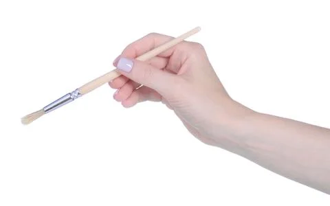 Paint brushe in hand Stock Photos