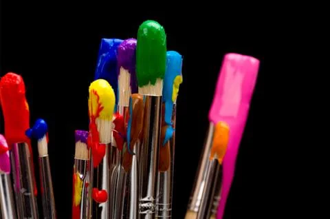 Paint brushes on black Stock Photos
