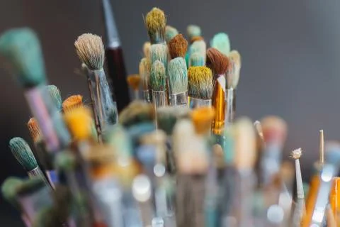 Paint Brushes on a blur background. close up Stock Photos