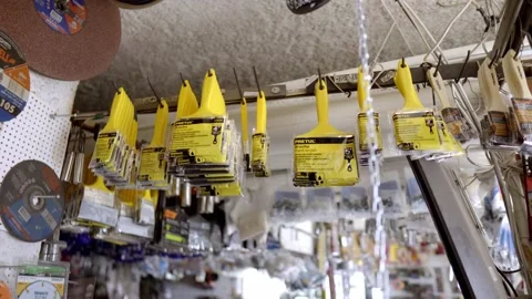 Paint brushes hanging inside hardware store Video stock 331272054