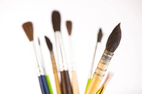 Paint brushes in a jar on whith background Stock-Fotos