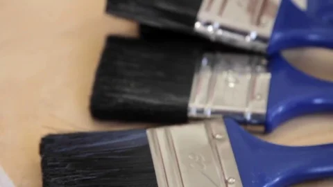 Paint brushes lying on the table Video stock 72931096