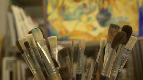Paint brushes in the pot on the table at drawing lesson Stock Footage 44009941