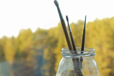 Paint brushes on the sunset Stock Photos