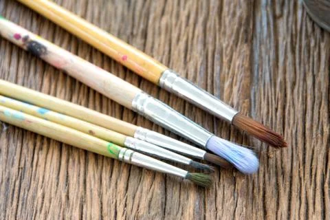 Paint brushes on  wood background Stock Photos