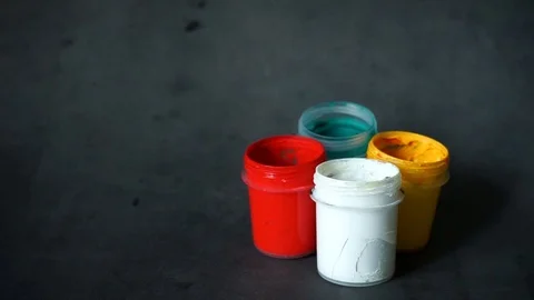 Paint can. colored cans with paint on black background. Stock Footage 99237705