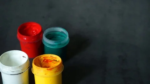 Paint can. colored cans with paint on black background. Stock Footage 99237707
