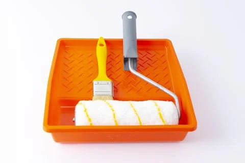 Paint can, roller and paint tray for painting wall on the floor Stock Photos