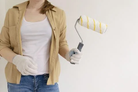 Paint can, roller and paint tray for painting wall on the floor Stock Photos