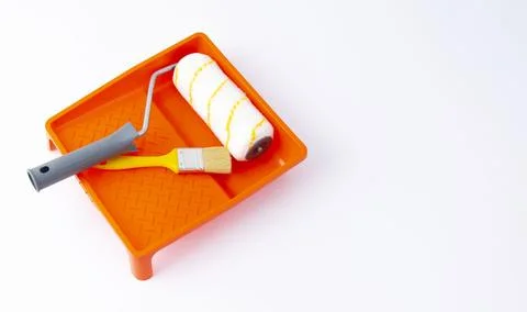 Paint can, roller and paint tray for painting wall on the floor Stock Photos
