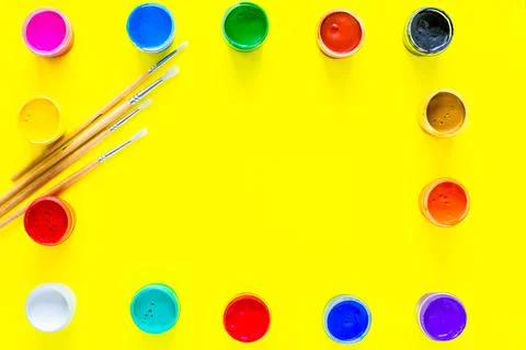 The paint cans are arranged in rectangles along the edge Stock Photos