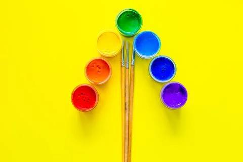 Paint cans stand at an angle, the colors are displayed Stock Photos