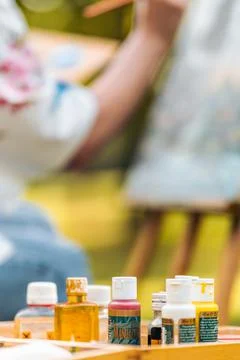 Paint containers on a surface Stock Photos