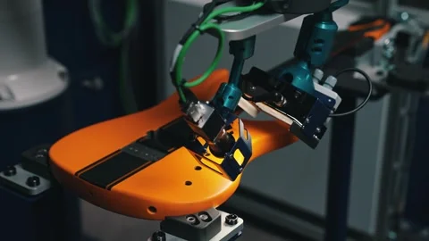 Paint control - using robot arm, producing guitars at the factory Stock Footage 274762595