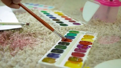 Paint drawing on a carpet close-up/art, brush, carpet, green, blue, red HD 動画素材 71001849