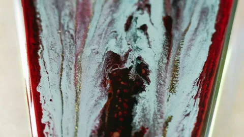 Paint drip glitter fluid spill blue red gold ink Video stock 268778743