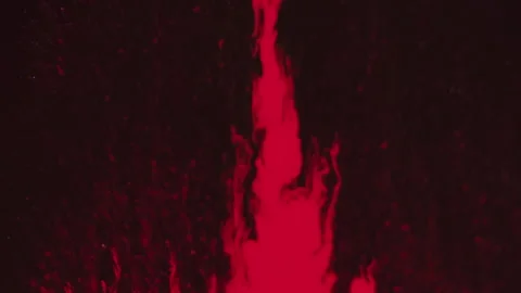Paint drip ink splash flow red splatter on dark Stock Footage 257642756