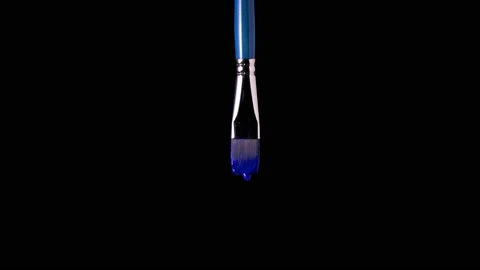 Paint drips from the brush on a black background 動画素材 170160914