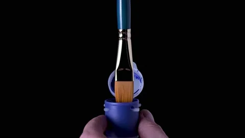 Paint drips from the brush on a black background 動画素材 170160919