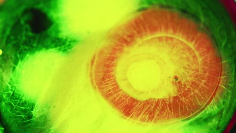 Paint drop ink water splash neon yellow red mix Stock Footage 256121627