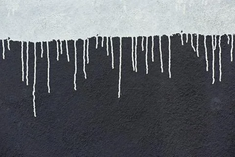 Paint drops on a wall Stock Photos