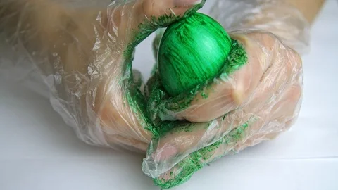 Paint on the egg with hands Stock Footage 88261650