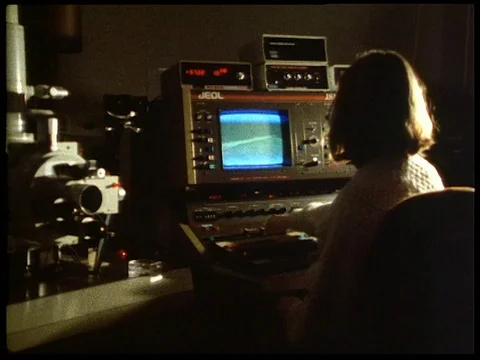 Paint examination under microscope, UK 1992 Stock Footage 136687482