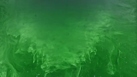 Paint fall into water which is twist. Spin acrylic ink drip into liquid. Visual Stock Footage 121110873