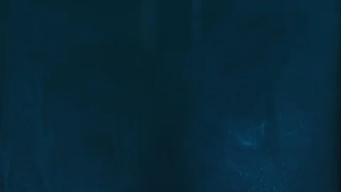 Paint fall into water which is twist. Spin acrylic ink drip into liquid. Visual Stock Footage 121252643