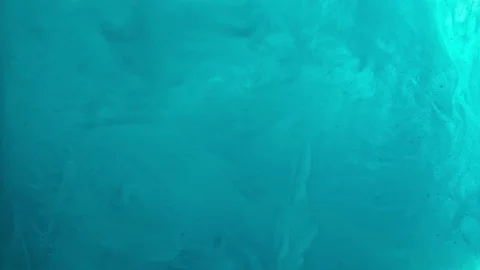 Paint fall into water which is twist. Spin acrylic ink drip into liquid. Visual Stock Footage 121383125