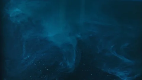 Paint fall into water which is twist. Spin acrylic ink drip into liquid. Visual Stock Footage 121605036