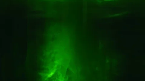 Paint fall into water which is twist. Spin acrylic ink drip into liquid. Visual Stock Footage 121864717