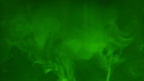 Paint fall into water which is twist. Spin acrylic ink drip into liquid. Visual Stock Footage 121864809