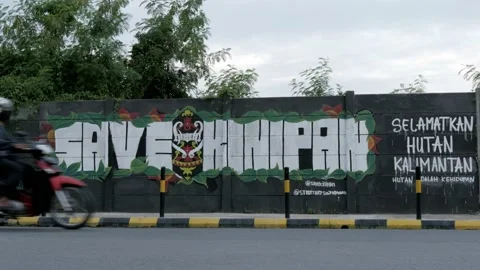 Paint graffiti art, Save Kinipan, indigenous forest of Dayak Tomun Stock Footage 136424754
