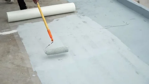 Paint the green floor with a paint roller for waterproof, reinforcing mesh, repa Stock Footage 169442596