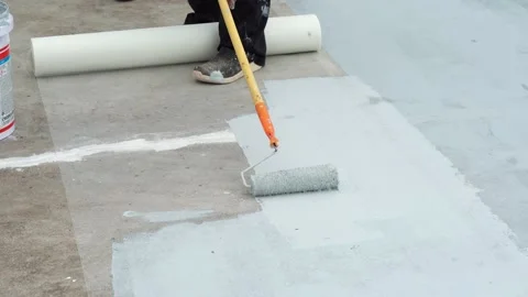 Paint the green floor with a paint roller for waterproof, reinforcing mesh, repa Stock Footage 169442750