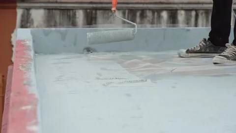 Paint the green floor with a paint roller for waterproof, reinforcing mesh, repa Stock Footage 169442823