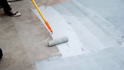 Paint the green floor with a paint roller for waterproof, reinforcing mesh, repa Stock Footage 169442835