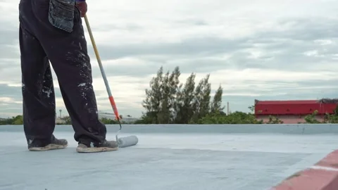 Paint the green floor with a paint roller for waterproof, reinforcing mesh, repa Stock Footage 169442891