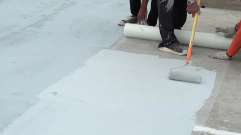 Paint the green floor with a paint roller for waterproof, reinforcing mesh, repa Stock Footage 169443529