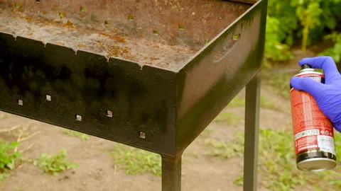Paint the grill with fireproof paint. Selective focus. Stock Footage 317251763
