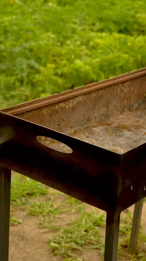 Paint the grill with fireproof paint. Selective focus. Stock Footage 317376305