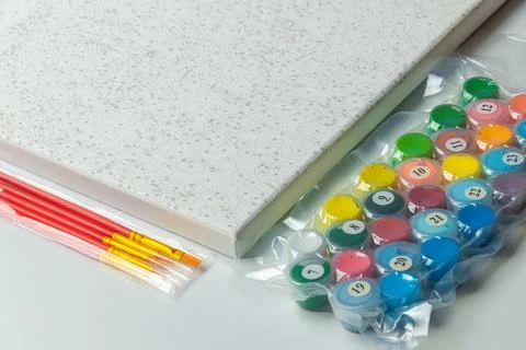 A paint-by-numbers kit, featuring a pre-drawn canvas with numbered sections.. Stock Photos
