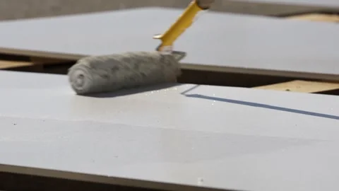 Paint plywood with a roller Stock Footage 265072453