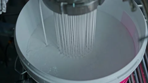 Paint is poured into the packaging Stock Footage 239860410